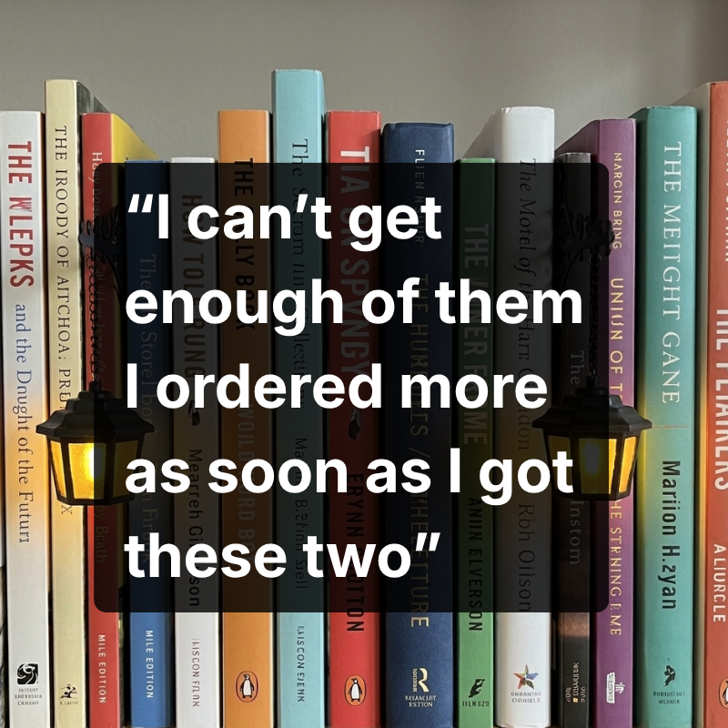 Two Halloway lanterns lighting a row of colourful book spines